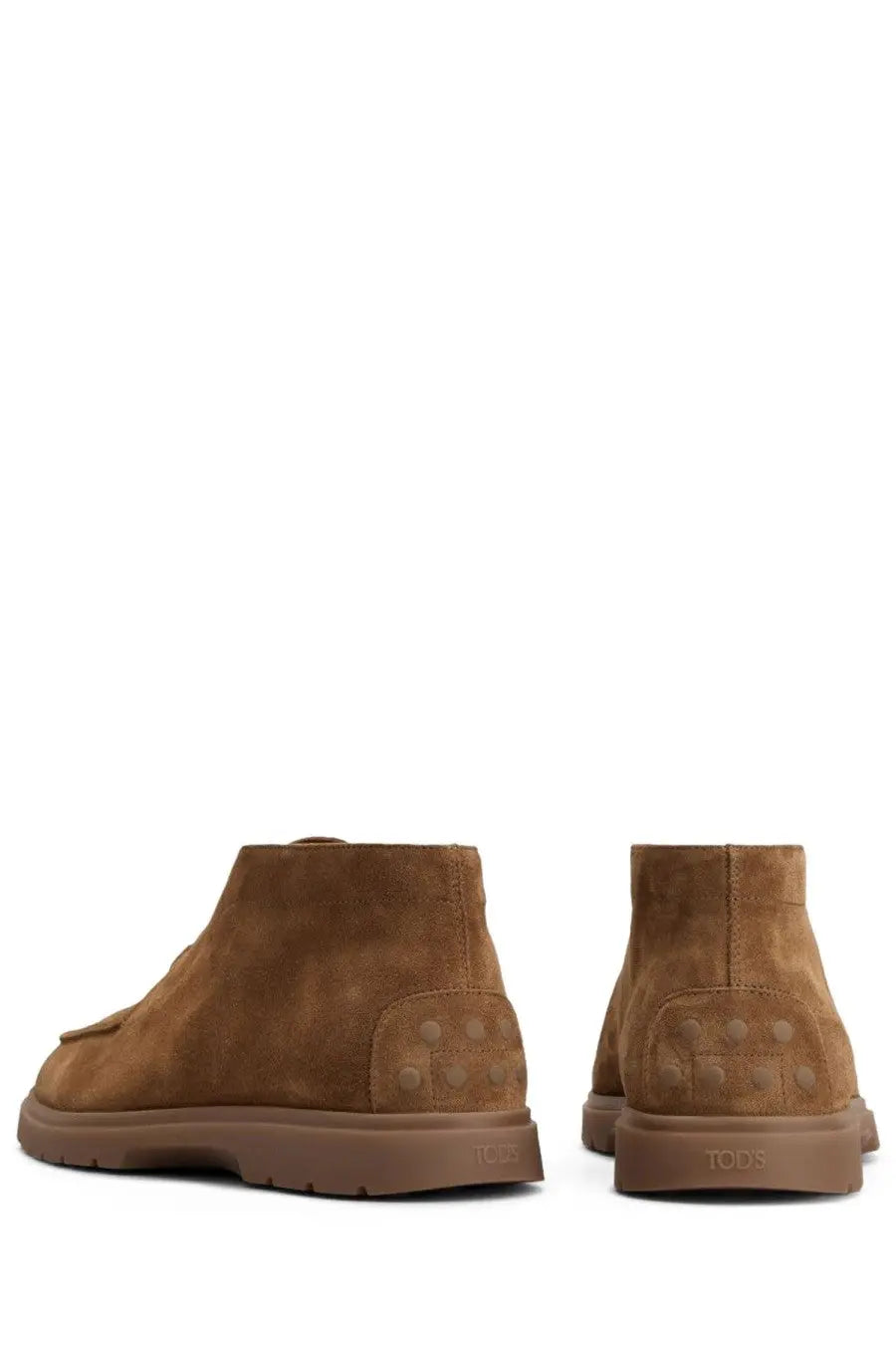Tan suede tods mens mocassino boots with chunky brown rubber sole and signature stud detailing on the heel back side