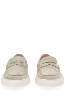 Tod’s men’s moccasin cassette beige suede loafers with classic penny loafer design and white rubber soles