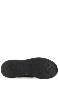 Tod’s men’s sneaker socks blue featuring a black rubber sole with circular tread patterns and subtle logo imprint
