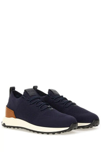 Tod’s men’s sneaker socks in navy blue knit with tan leather accents and a white rubber sole