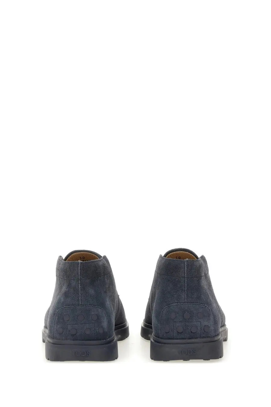 Dark blue suede chukka boots with embossed logo on the heel from Tod’s men’s suede loafer blue collection showing back view