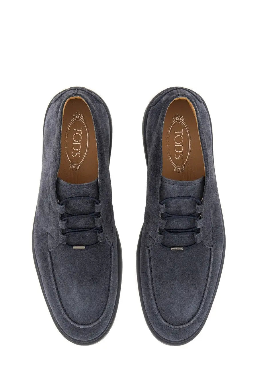 Tod’s men’s suede loafer in dark blue with black laces and a classic slip-on design