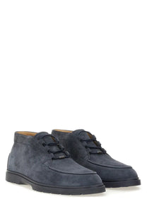 Tod’s men’s navy blue suede chukka boots with black laces and textured rubber sole for casual wear