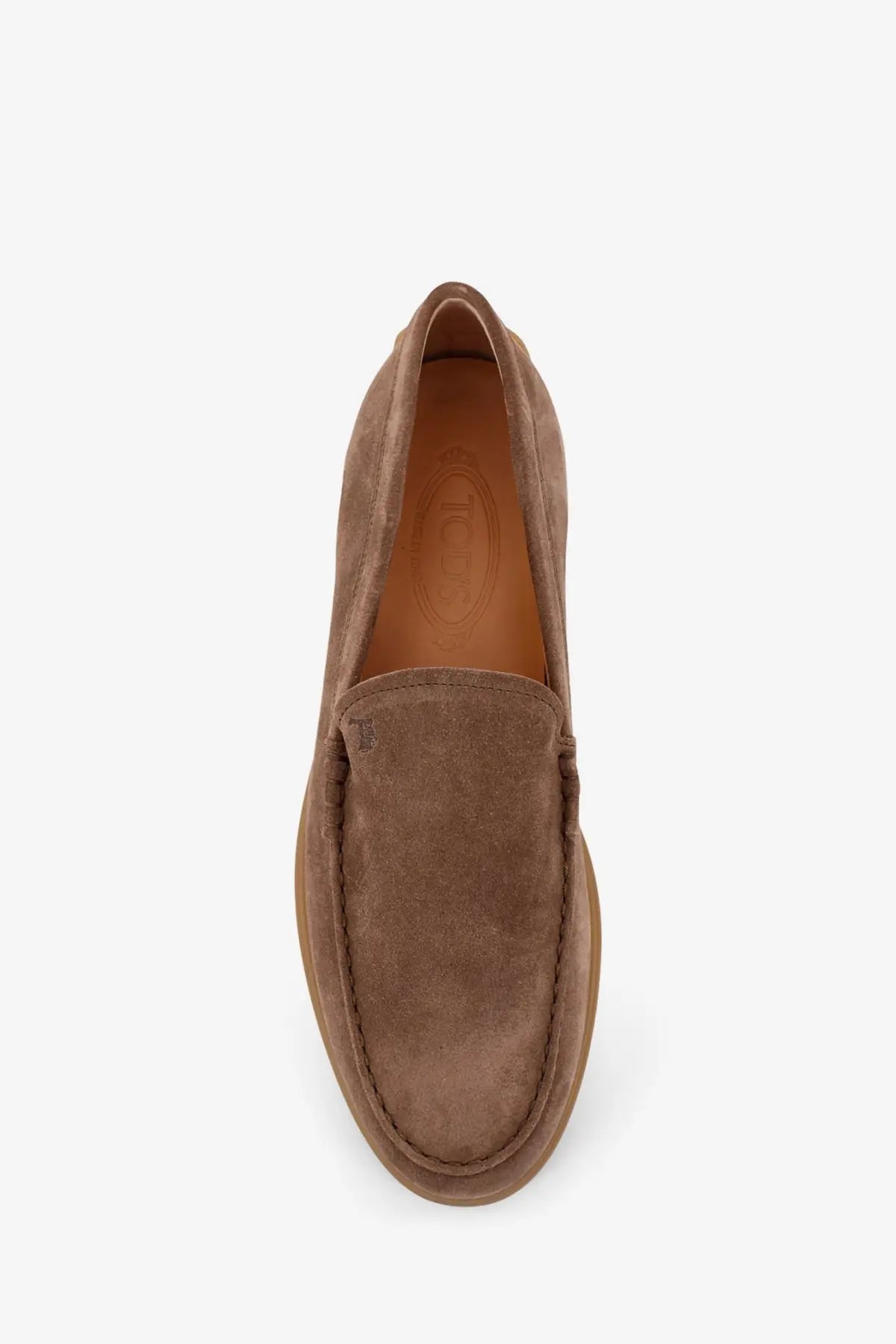 Tod’s men’s brown suede loafers with a classic slip-on design and visible stitching along the seams