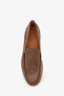 Tod’s men’s brown suede loafers with a classic slip-on design and visible stitching along the seams