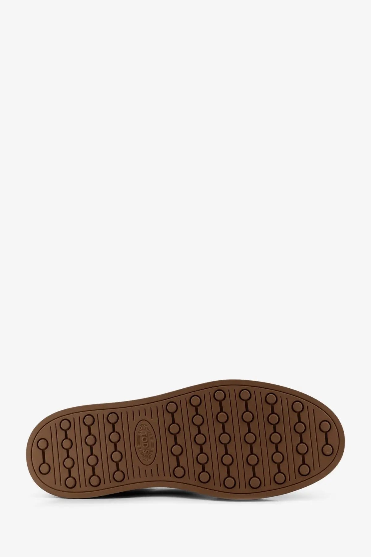 Brown rubber sole with circular tread pattern and embossed logo on tods men’s suede sneakers brown