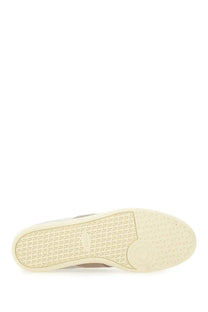 Cream-colored rubber sole with textured pattern and subtle branding on tods men’s tabs sneaker beige