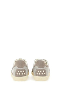 Tod’s men’s tabs sneaker beige low-top gray suede and leather with cream rubber sole and white stud heel detailing back view