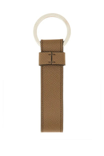 Tods men’s timeless keychain in tan leather with textured surface and silver toned metal ring for keys