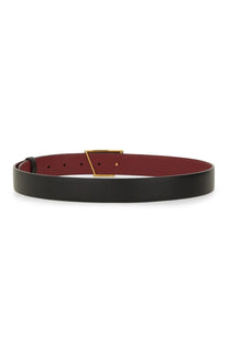 Tod’s women’s cintura reversibile black leather belt with burgundy interior and gold-tone triangular buckle