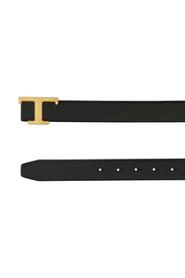 Tod’s women’s black leather belt with gold-tone t buckle reversible design for stylish wear