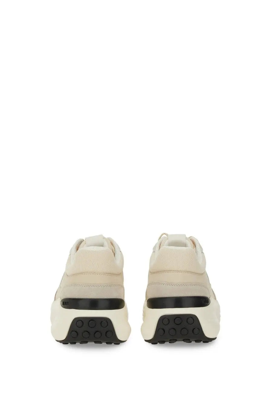 Tod’s women’s fabric and suede sneaker beige with cream-colored suede and chunky black rubber sole with circular tread pattern