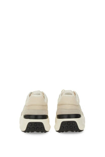 Tod’s women’s fabric and suede sneaker beige with cream-colored suede and chunky black rubber sole with circular tread pattern