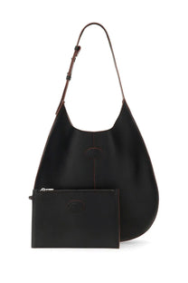 Tods women’s black leather hobo bag with contrasting brown stitching and matching small zippered pouch