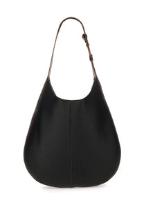 Tod’s women’s black leather hobo bag with a single shoulder strap and subtle stitching details