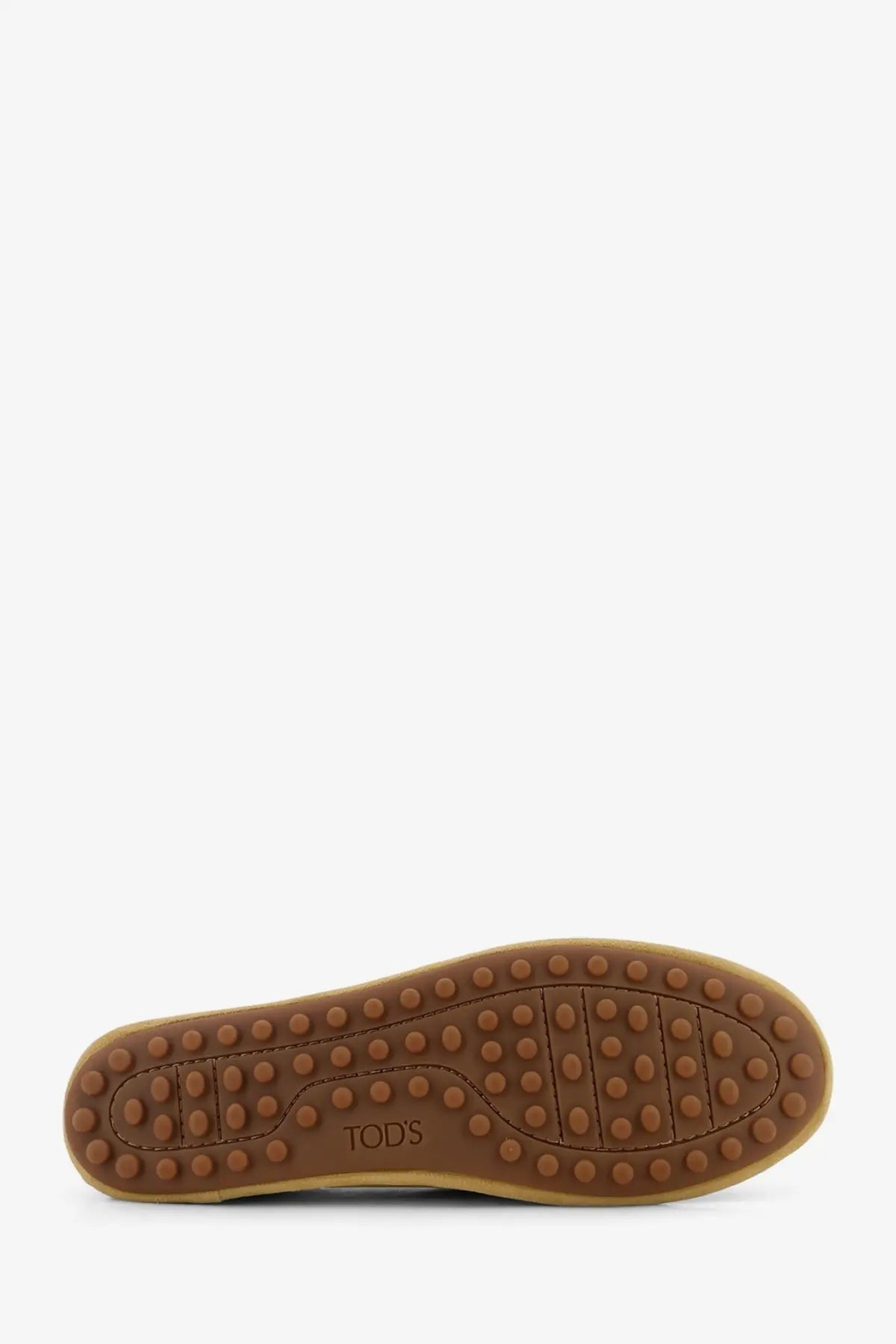 Brown rubber sole with textured pattern and tods logo embossed in center of tods women’s yellow leather ballerina shoe