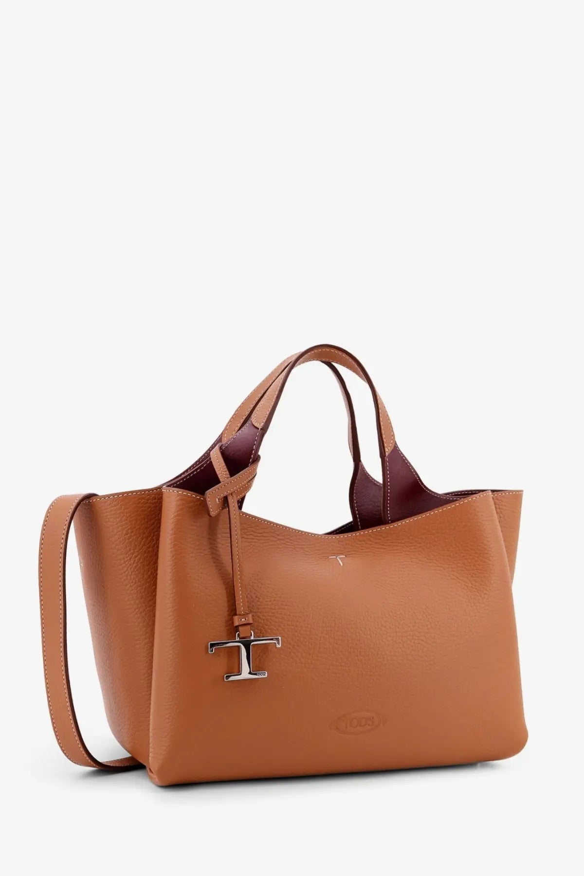 Tod’s women’s brown leather crossbody bag with tan leather tote design and burgundy interior with silver t logo charm