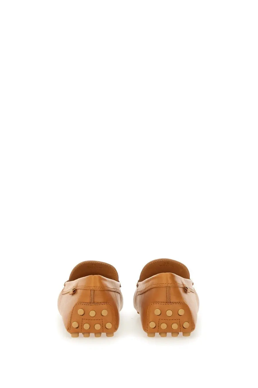 Tod’s women’s leather gommino loafer beige in tan leather with classic slip-on design and rubber soles with circular studs