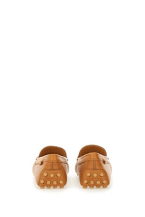 Tod’s women’s leather gommino loafer beige in tan leather with classic slip-on design and rubber soles with circular studs
