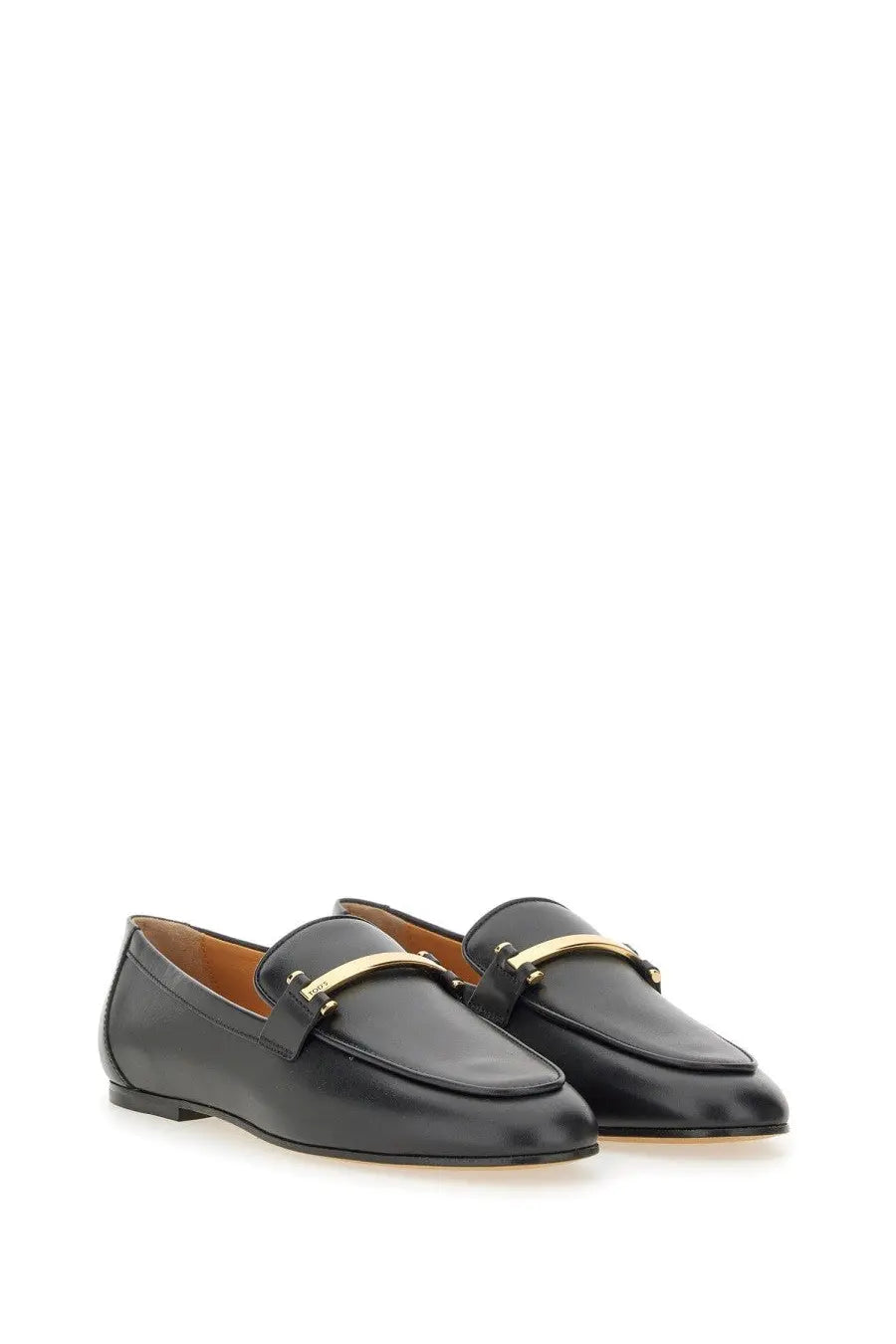 Tod’s women’s black leather loafers with a gold-tone metal bar across the toe for stylish comfort