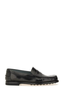 Tod’s women’s leather loafer in black patent leather with a glossy finish and distinctive lug sole