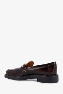 Tod’s women’s dark brown leather loafers with gold-tone metal buckle and chunky black rubber sole