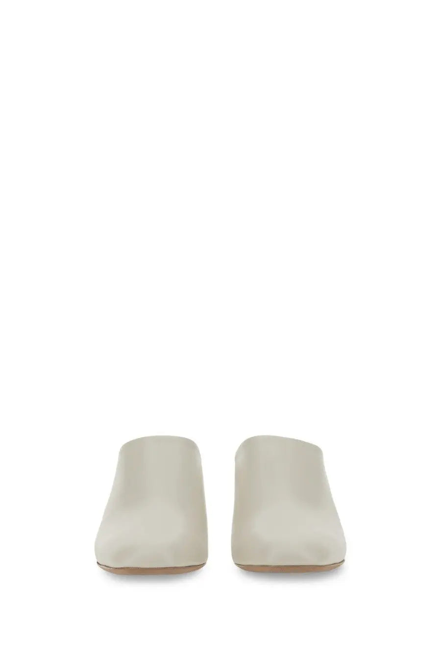 Tod’s women’s cream-colored leather suede mules with a sleek minimalist design perfect for casual wear