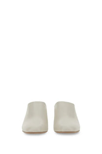Tod’s women’s cream-colored leather suede mules with a sleek minimalist design perfect for casual wear