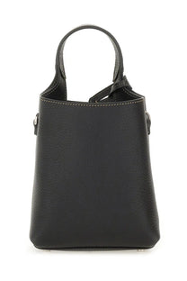 Tod’s women’s micro bag Tods black textured leather bucket bag with light stitching and silver toned hardware