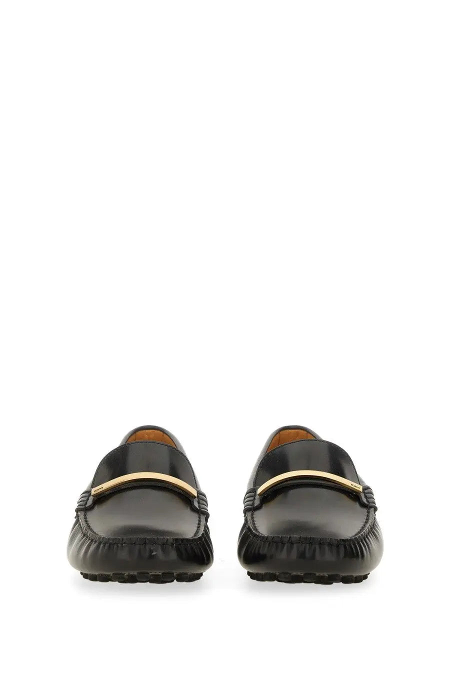 Tod’s women’s moccasin rubbermaid black leather loafers with a gold-tone metal bar across the toe