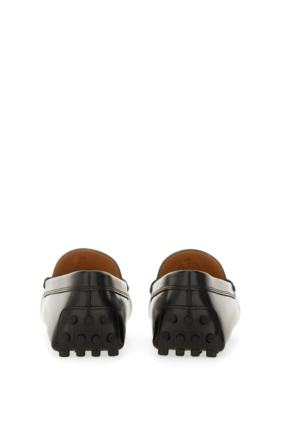 Tod’s women’s moccasin Rubbermaid black leather loafers with a glossy finish and textured rubber soles