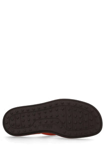 Back side of tods womens sandalo infradito con orange with black rubber sole textured pattern and tods logo embossed near heel