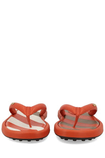 Tod’s women’s orange flip-flops with striped insole pattern and small gold-tone logo accents