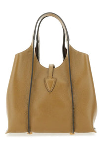 Tod’s women’s timeless mini shopping bag beige tan pebbled leather tote with black trim and shield-shaped front flap