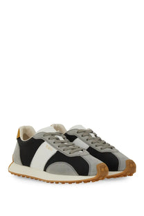 Tod’s women’s vintage sneaker grey with black gray and white panels and a tan rubber sole for casual wear