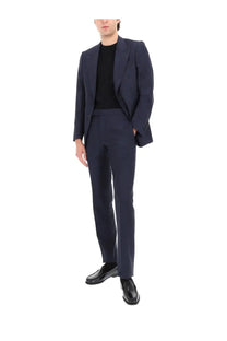 Tom Ford men’s Grand Overcheck Shelton suit in navy blue with sleek modern cut and subtle textured fabric