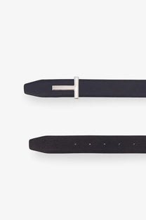 Tom Ford men’s black leather belt featuring a sleek silver-toned t-shaped hammered buckle