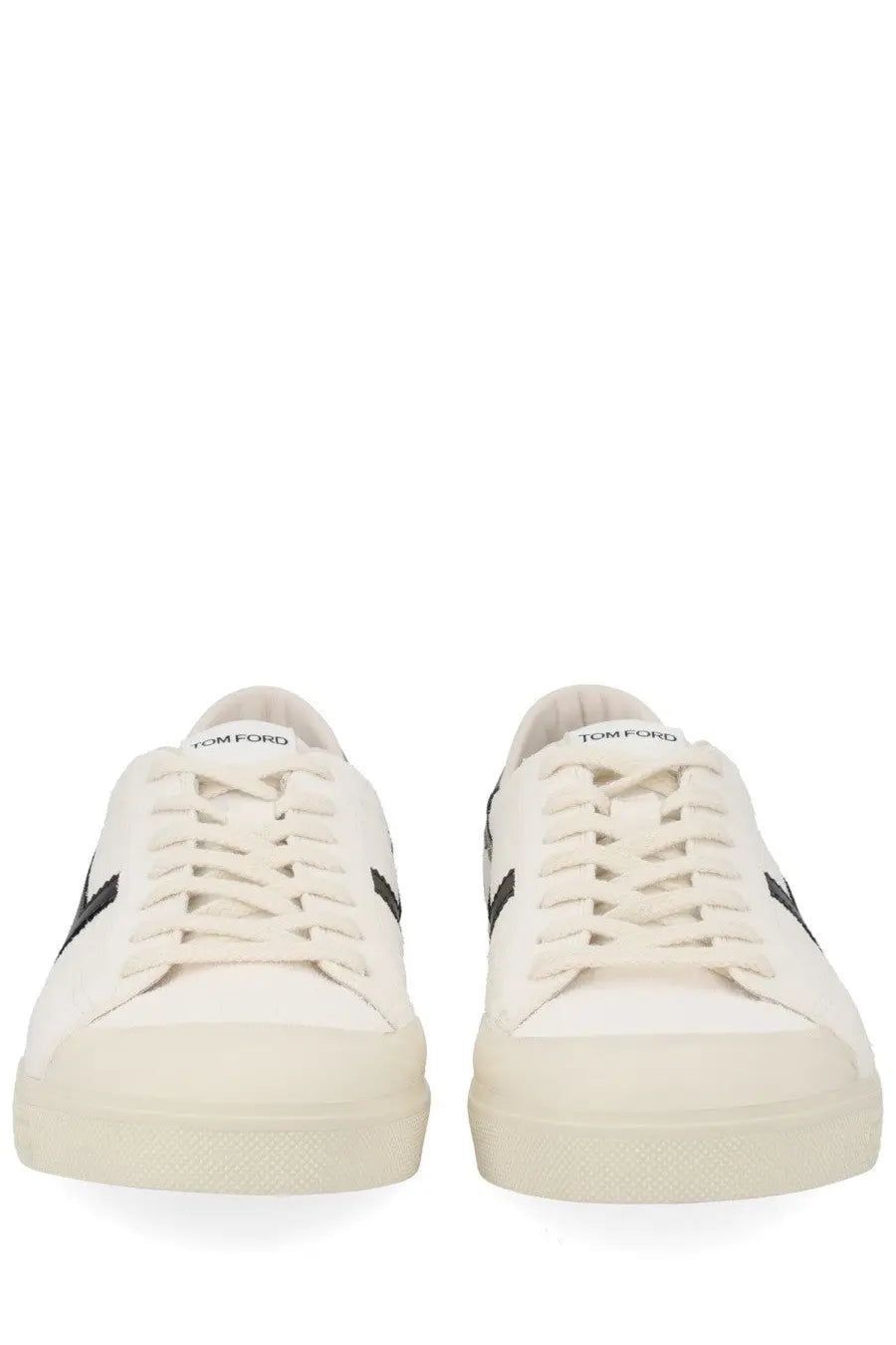 White canvas tom ford men’s jarvis sneaker with black stripes and tom ford branding on the tongue