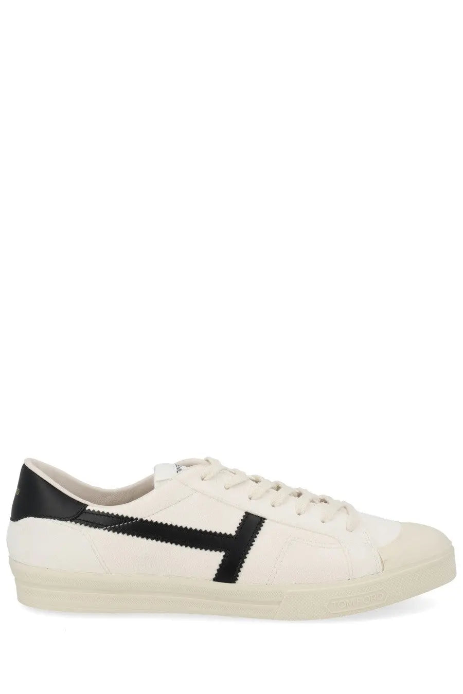 Tom Ford men’s Jarvis sneaker white low-top with black leather accents and a bold zigzag stripe on the side