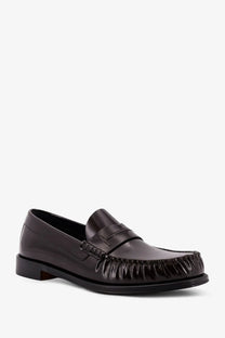 Tom Ford men’s brown leather loafer with black patent leather moccasin featuring fringed toe and stitched detailing
