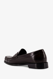 Tom Ford men’s dark brown leather loafer with polished finish and classic moccasin-style stitching