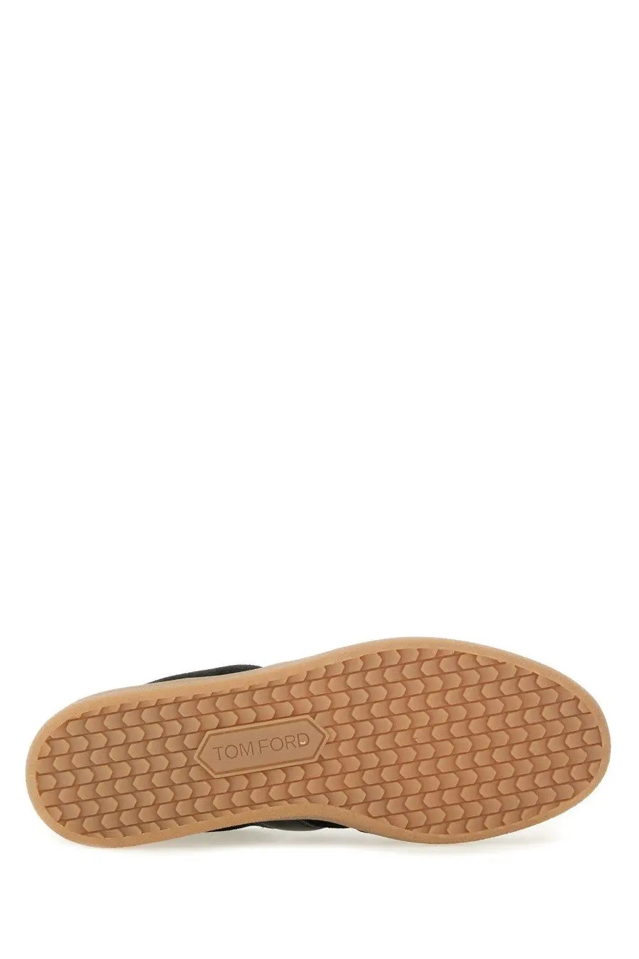 Tom Ford men’s leather sneaker black featuring black suede low-top design with tan rubber sole and hexagonal tread pattern