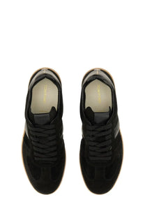 Tom ford men’s leather sneaker black in black suede with tan rubber soles and a minimalist design