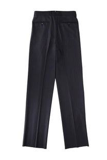 Black tailored trousers with straight-leg cut and buttoned back pockets shown from the back by tom ford men