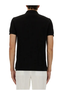 Tom Ford men’s black pique polo shirt with classic collar and ribbed cuffs in short sleeves