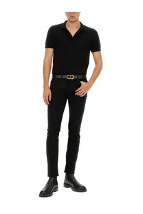 Tom ford men’s piquet polo black paired with black slim-fit jeans featuring a sleek modern cut and subtle stitching details