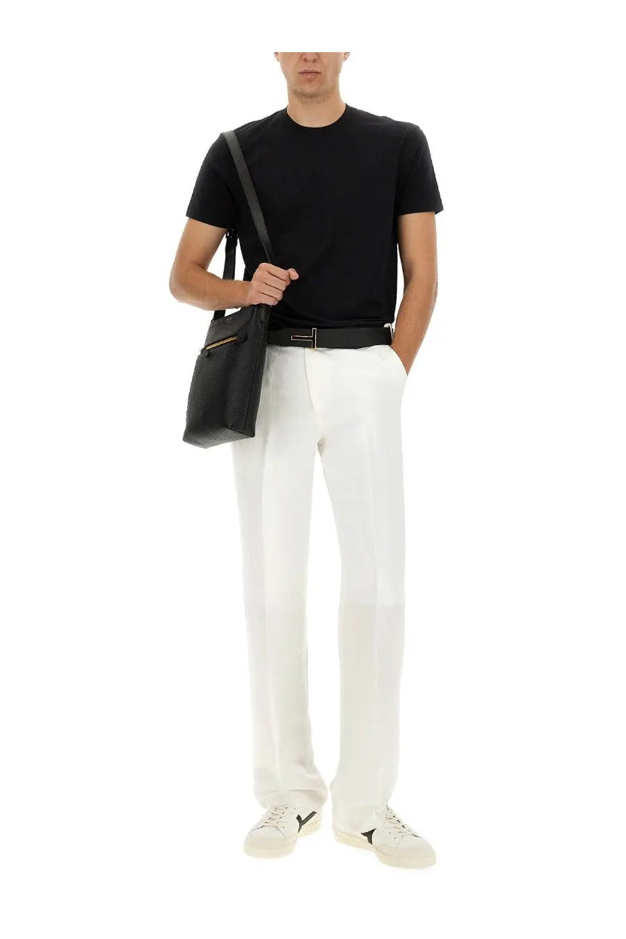 Black leather crossbody bag with gold zipper detail complementing tom ford mens regular fit shirt black