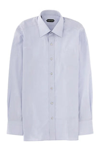 A crisp light blue tom ford men’s dress shirt with classic pointed collar and button-down front for formal wear