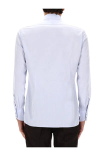 Tom Ford men’s blue dress shirt with classic collar and buttoned cuffs made from crisp white fabric