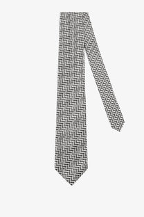 Tom Ford men’s silk tie grey featuring a sleek black and white zigzag pattern with a classic pointed tip